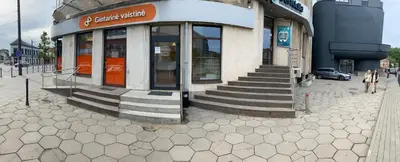 a building with stairs in front of a store at Mr Jo’s hostel in Kaunas