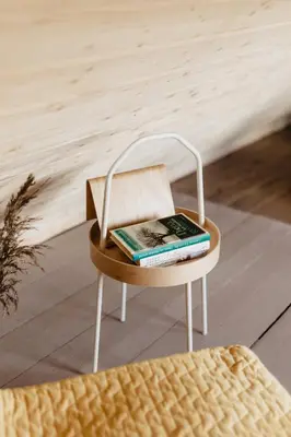 a chair with a book on top of it at Vienkiemio Oazė - Namelis Prie Upelio in Galvokai