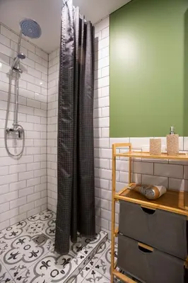 a bathroom with a shower with black shower curtain at Groundfloor Apartment on the Green Hill in Kaunas