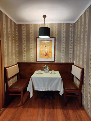 a dining room with a table and two chairs at Motelis SMAKŲ SMAKAS in Šiauliai