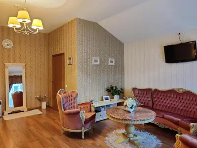 a living room with a couch and a table at Motelis SMAKŲ SMAKAS in Šiauliai