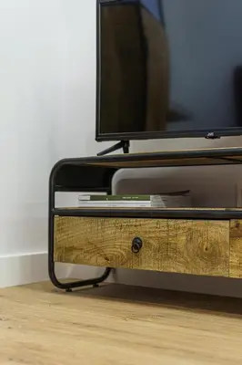 a flat screen tv sitting on top of a wooden table at Modern Rustic in Center-PRIME RENTALS in Kaunas