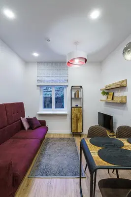 a living room with a couch and a table at Modern Rustic in Center-PRIME RENTALS in Kaunas