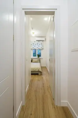 a hallway with a door leading to a bedroom at Modern Scandinavian Feeling-PRIME RENTALS in Kaunas