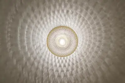 a light hanging from the ceiling of a room at Modern Scandinavian Feeling-PRIME RENTALS in Kaunas