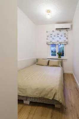 a bedroom with a bed and a window at Modern Scandinavian Feeling-PRIME RENTALS in Kaunas