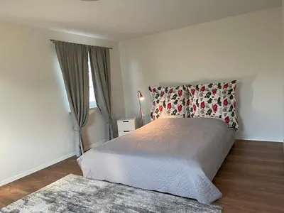 a bedroom with a bed and a window at Mandarinas in Anykščiai