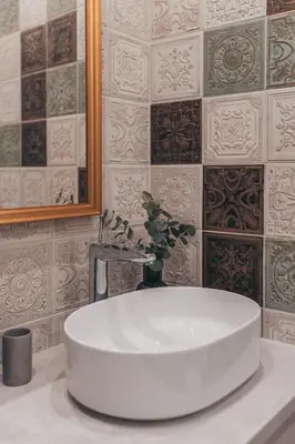 a white sink in a bathroom with a mirror at Lindens apartments with AC and view to central square in Panevėžys