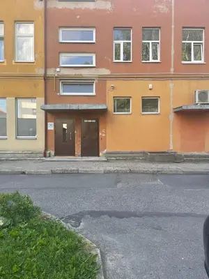 an empty street in front of a building at Lindens apartments with AC and view to central square in Panevėžys