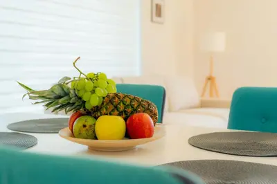 a bowl of fruit sitting on a table at Jaukus svečių namelis in Druskininkai