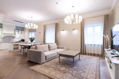 a living room with a couch and a table at Luxury 2BDR Heart Of Old Town in Vilnius