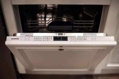 a white stove top oven with several boxes on it at Luxury 2BDR Heart Of Old Town in Vilnius