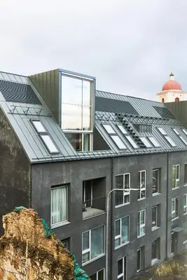 a building with solar panels on the roof at New and Lovely Apartament in Vilnius City Centre in Vilnius