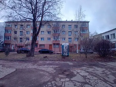 an empty parking lot in front of a building at Butas miesto centre - bulvare in Šiauliai