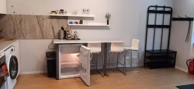 a kitchen with a counter and a small refrigerator at Elite Flats Two bedroom in Utena