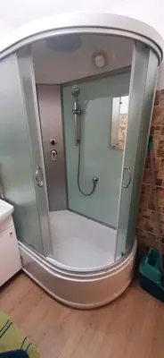 a shower with a glass door in a room at Elite Flats Two bedroom in Utena