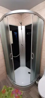 a shower with a mirror in a bathroom at Elite Flats One bedroom in Utena