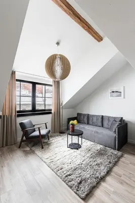a living room with a couch and a table at Angel House Vilnius, Old Town 6 in Vilnius