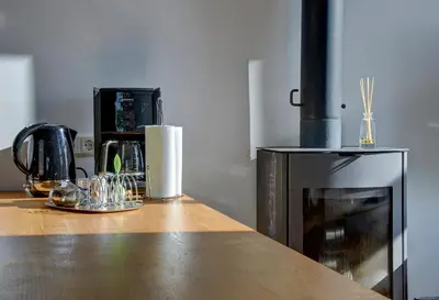 a kitchen with a counter top with glasses on it at Loft 65 Panoramic View in Vilnius