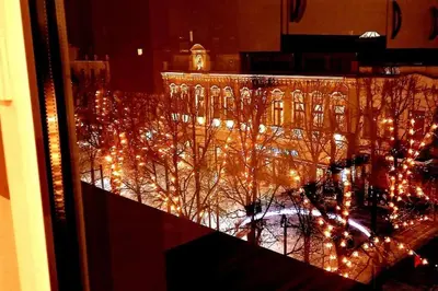 a view of a building with christmas lights at Laisves Apartment Kaunas in Kaunas