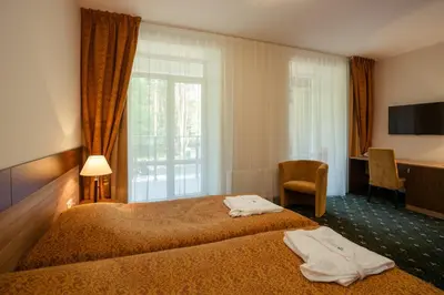 a hotel room with a bed and a window at Medical SPA 