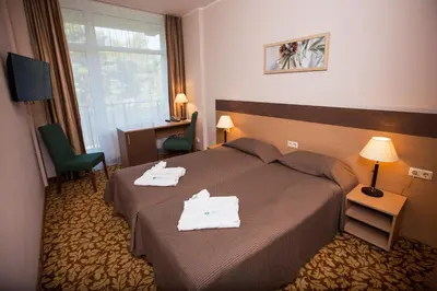 a hotel room with a bed with towels on it at Medical SPA 
