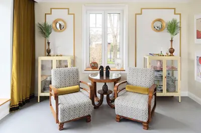 a living room with a table and two chairs at Entire interwar Villa Grabyte by pine forest on the bank of the river- 8min by car from old town in Kaunas