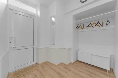 an empty room with white walls and a closet at Vilnius Old Town apartment in Vilnius