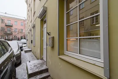 a building with a window on the side of a street at Vilnius Old Town apartment in Vilnius