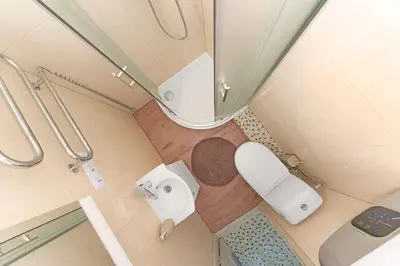 an overhead view of a bathroom with a toilet at Vilnius Old Town apartment in Vilnius
