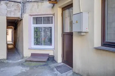 an entrance to a building with a door and a window at Mini apartament by Town hall, self chek-in in Vilnius