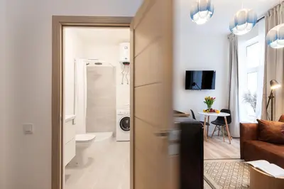 a living room with a toilet and a bathroom at #stayhere - Modern & Central Studio Apartments in Vilnius