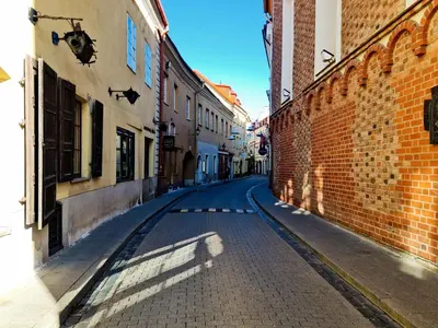an empty street in an alley between buildings at ReHouse Stikliu 4 in Vilnius