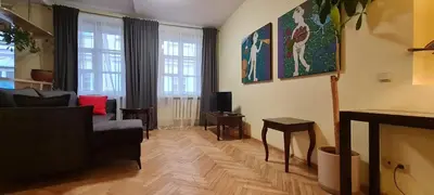 a living room with a couch and a fireplace at ReHouse Stikliu 4 in Vilnius