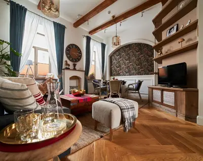 a living room with a couch and a table at Luxury OldTown Free Parking in Vilnius