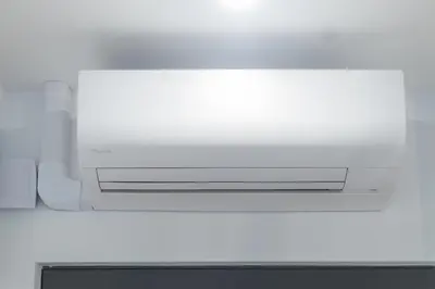 a white microwave oven sitting on top of a counter at cohost I New Bastėja Life Apartments w-Garage Prkg & Self Check-in in Vilnius