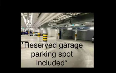 a parking lot with the words reserved garage parking spot included at cohost I New Bastėja Life Apartments w-Garage Prkg & Self Check-in in Vilnius