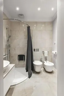 a bathroom with two sinks and a shower and a toilet at Design Studio Apartment with Balcony by Domvia in Kaunas