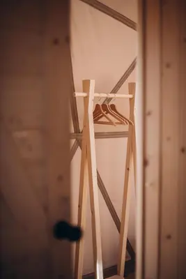 a wooden ladder standing in a room at VasaRojaus Kupolai in Birštonas