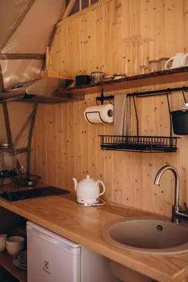 a kitchen counter with a tea kettle on it at VasaRojaus Kupolai in Birštonas