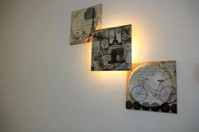 a wall with three pictures of a bike on it at Cozy apartment in Jeruzalė in Vilnius