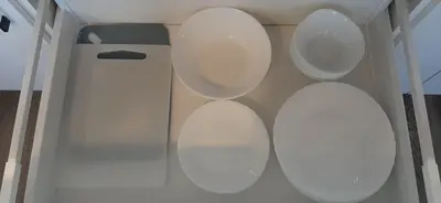 a row of white toilets in a room at Familia Apartments in Vilnius