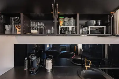 a kitchen with a sink and a counter top at Retro Studio Old Town Apartment by Domvia in Kaunas