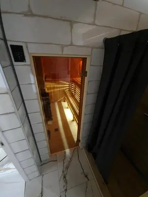 an overhead view of an open door in a room at Sipis House in Šiauliai