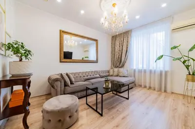 a living room with a couch and a table at E. D. Angel Wing Apartment in Šiauliai