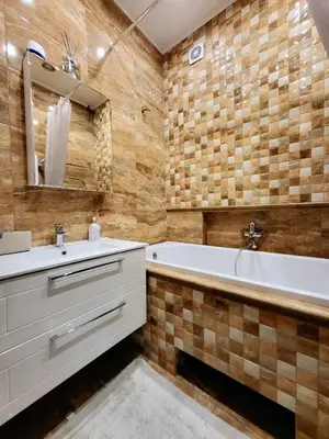 a bathroom with a tub and a sink and a bath tub at E. D. Angel Wing Apartment in Šiauliai