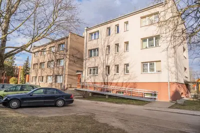 a car parked in front of a building at Čia gera studio in Anykščiai