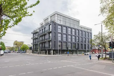a large building on the corner of a street at Vilnius Cozy Loft in Vilnius