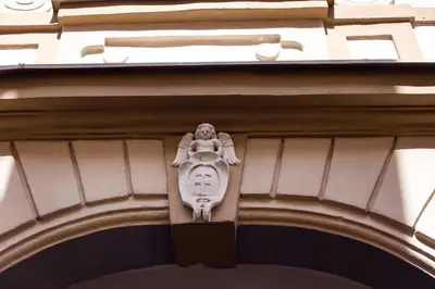 a building with a statue on the side of it at #stayhere - Historic Vilnius Old Town Chic Studio in Vilnius