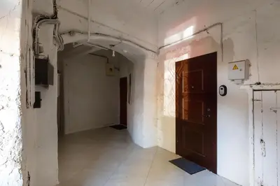 an empty hallway with a door in a building at #stayhere - Historic Vilnius Old Town Chic Studio in Vilnius